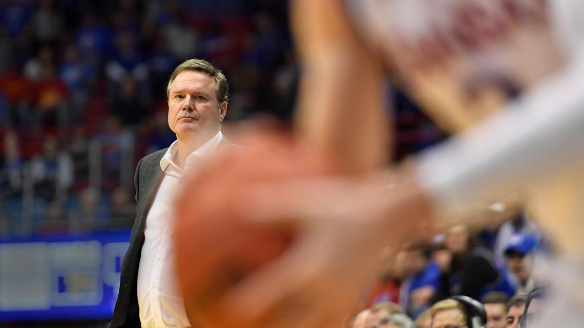 KU coach Bill Self (background) looked on as freshman Christian Braun lines up another three-point shot during the second half of Thursday night’s exhibition game at Allen Fieldhouse. KU beat Pittsburg State 102-42 (Oct. 31, 2019).