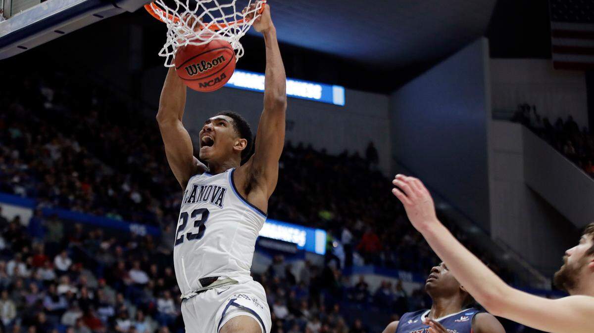 Villanova’s Jermaine Samuels (23) dunks against St. Mary’s Malik Fitts (24) during the second half of a first round men’s college basketball game in the NCAA Tournament, Thursday, March 21, 2019, in Hartford, Conn. (AP Photo/Elise Amendola)
