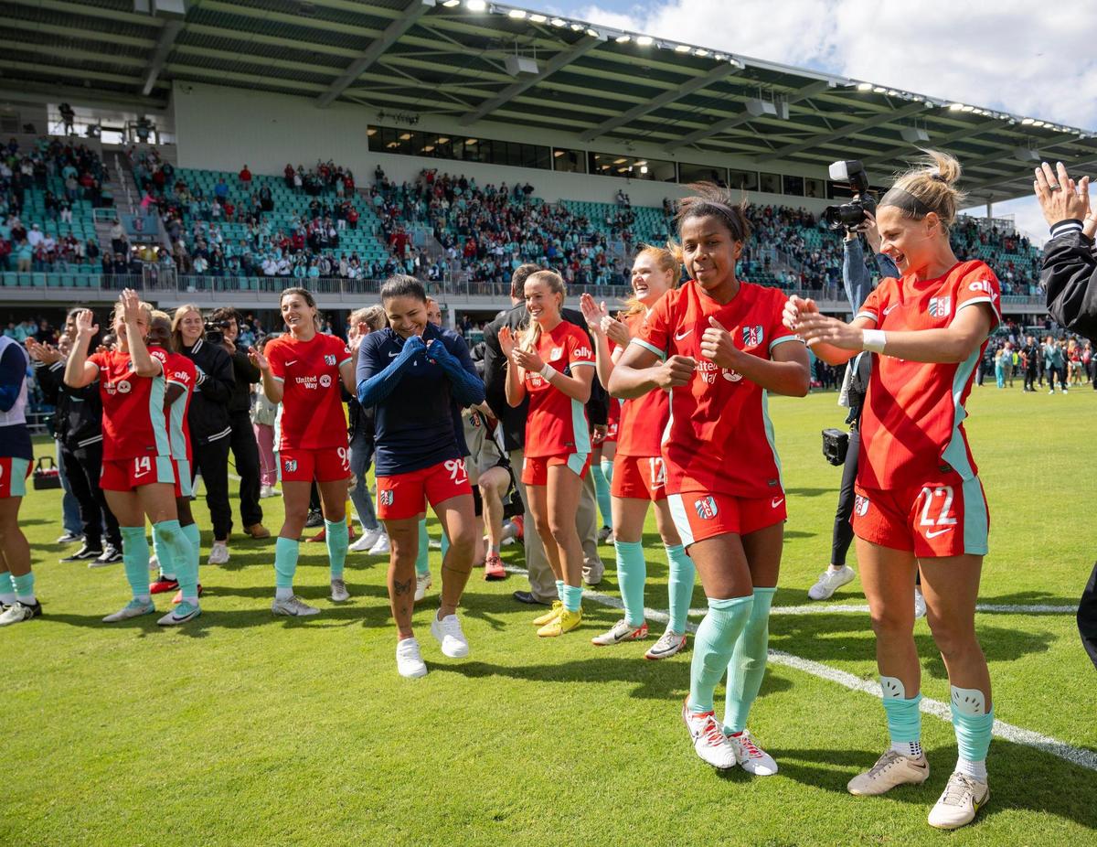 Members of the Kansas Current celebrate after defeating the Portland Thorns 5-4 in the home opener at the new CPKC Stadium on Saturday, March 16, 2024, in Kansas City.