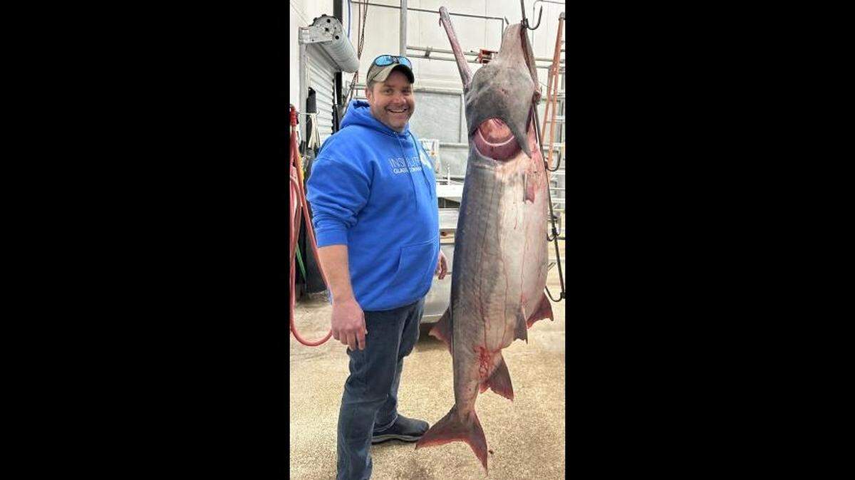Chad Williams of Olathe caught this 164-pound, 13-ounce paddlefish on St. Patrick’s Day at the Lake of the Ozarks, setting a world record for the largest paddlefish caught.