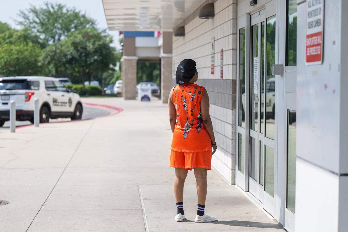 Denise Coleman of Kansas City stands at the door of Sun Fresh Linwood on Wednesday, Aug. 13, 2025, in Kansas City. The troubled grocery store closed the previous day and only had a sign posted on the door announcing to customers that it would not reopen.