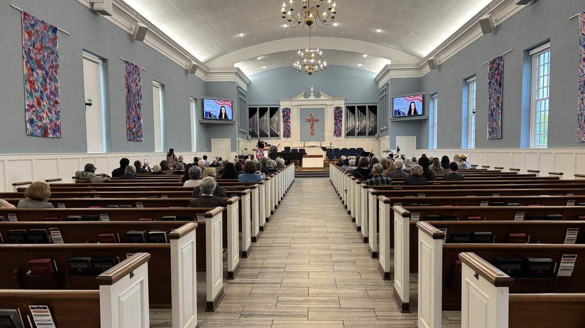 Attendees gathered at Asbury United Methodist Church on April 30, 2026, for a prayer vigil and rally supporting immigrants in the Kansas City metro.