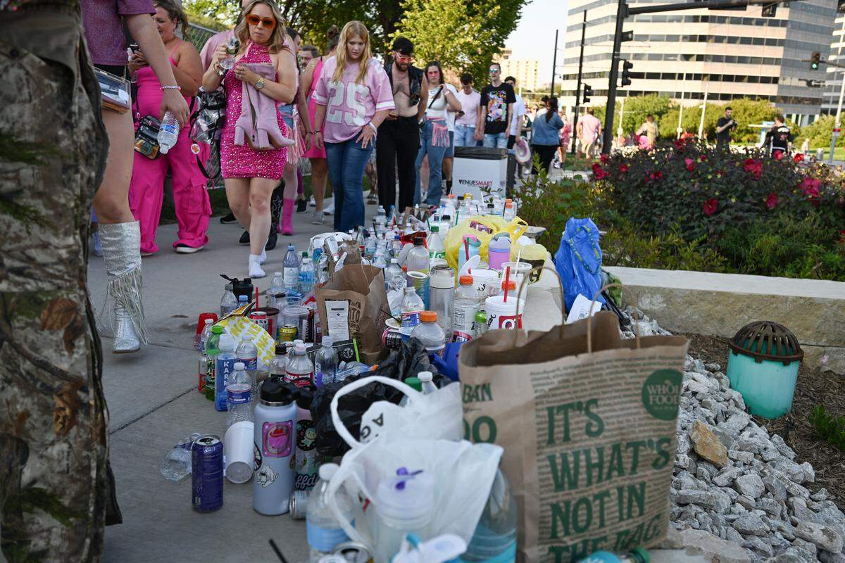 Items not allowed into the venue pile up as fans stream in to the concert grounds before the Chappell Roan Concert on Friday, Oct. 3, 2025, at the National WWI Museum and Memorial.