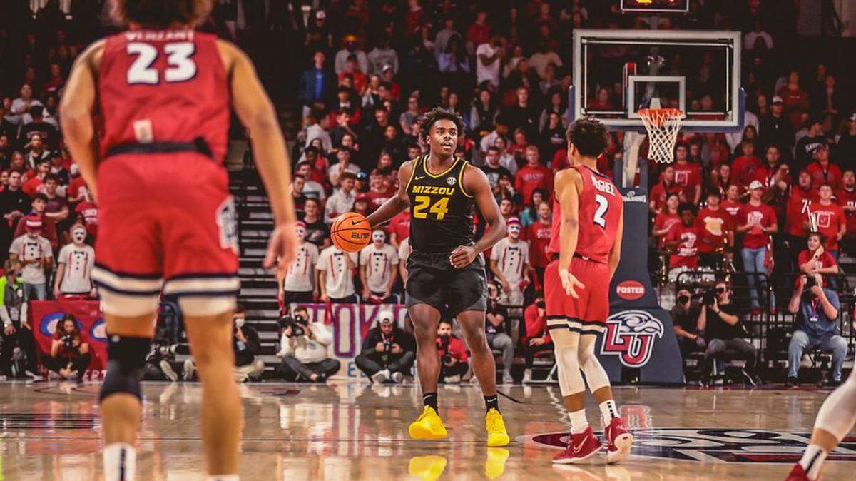 Forward Kobe Brown dribbles the ball in a 66-45 loss for Missouri men’s basketball on the road against Liberty on Dec. 2.