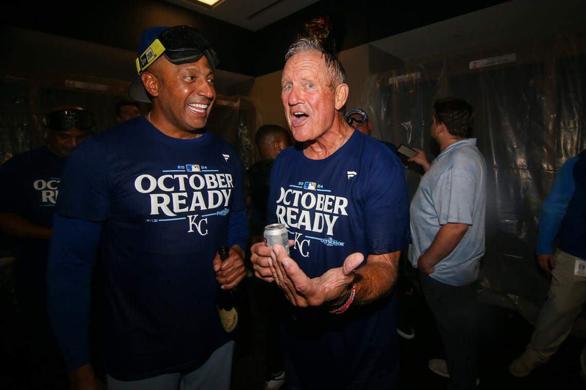 Kansas City Royals infield coach Jose Alguacil (68) and former player George Brett celebrate after clinching a wild card playoff birth after a game against the Atlanta Braves at Truist Park.