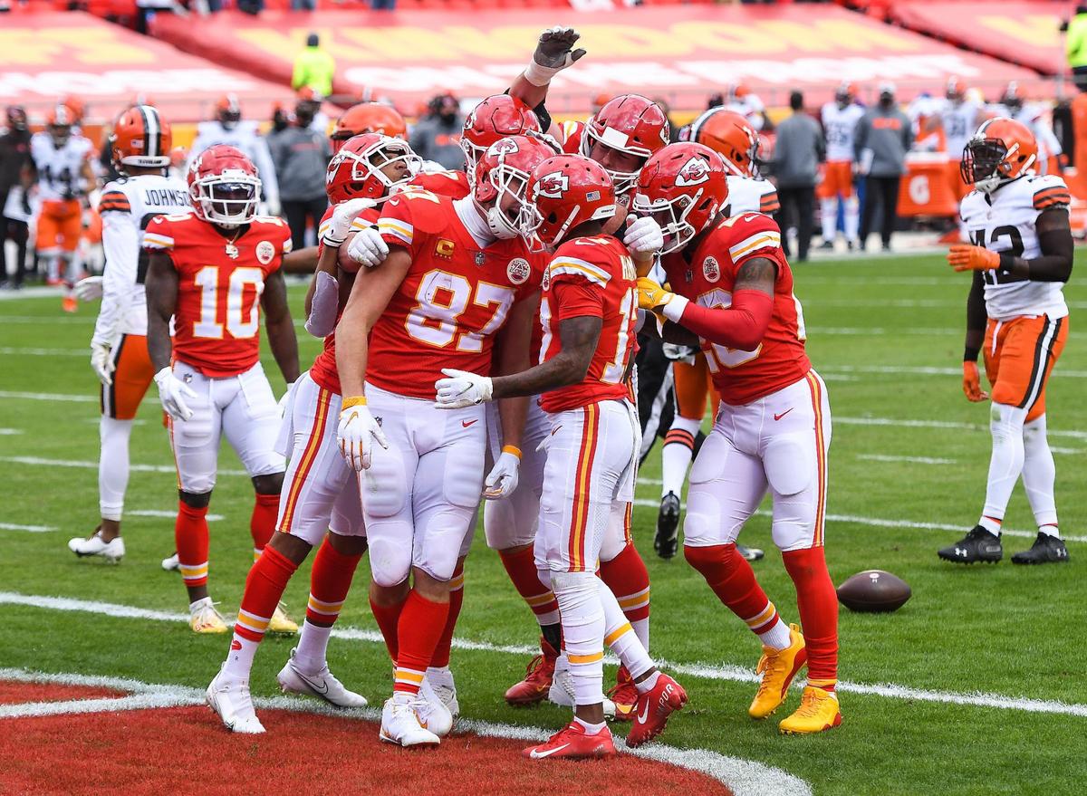 Kansas City Chiefs tight end Travis Kelce, 87, celebrates with teammates after scoring on a pass in the first quarter against the Cleveland Browns Sunday, January 17, 2021, at Arrowhead Stadium in Kansas City, Missouri.
