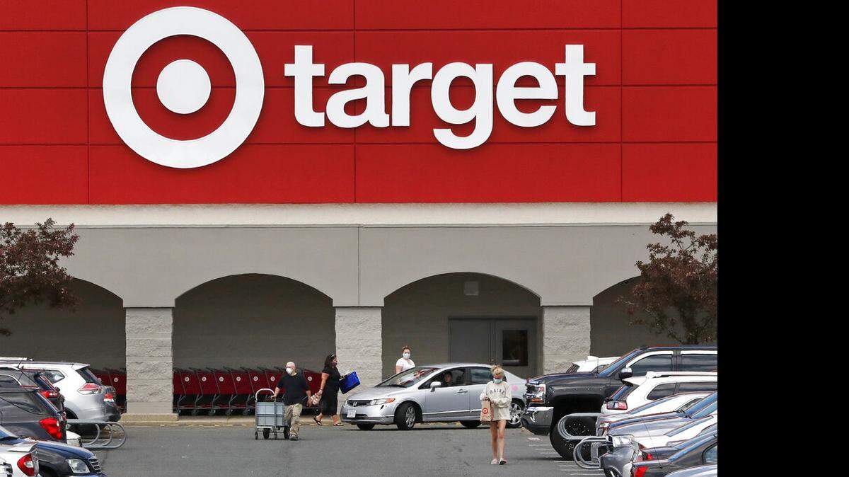 This May 15, 2020, file photo shows customers outside a Target store in Danvers, Mass. (AP Photo/Charles Krupa, FIle)