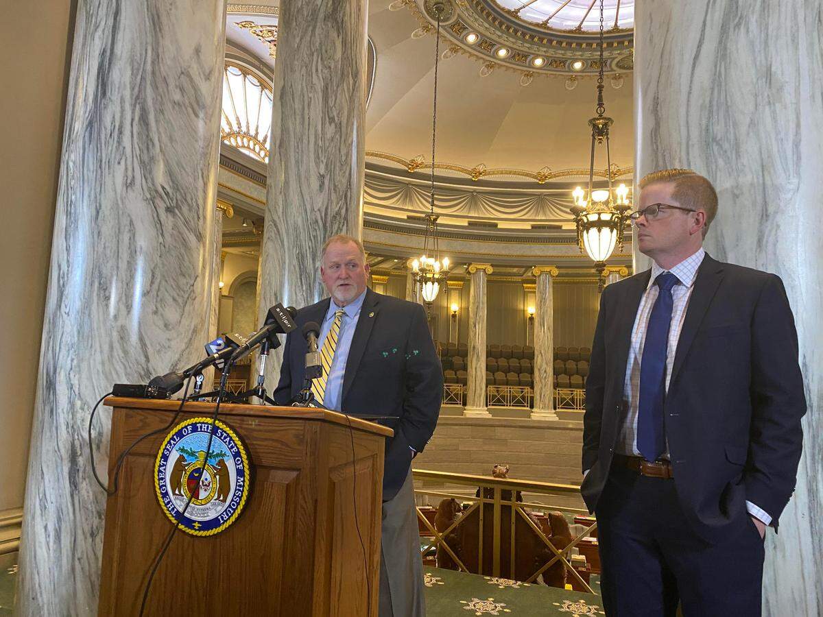 Missouri Senate President Pro Tem Dave Schatz, left, speaks to reporters as Senate Majority Leader Caleb Rowden stands nearby. Schatz cast a deciding vote in whether to send a bill renewing a Medicaid provider tax back to conference committee.
