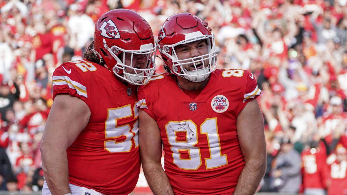 Kansas City Chiefs tight end Blake Bell (81) celebrates with center Creed Humphrey (52) after scoring against the Denver Broncos during a game at GEHA Field at Arrowhead Stadium on Jan. 1, 2023.