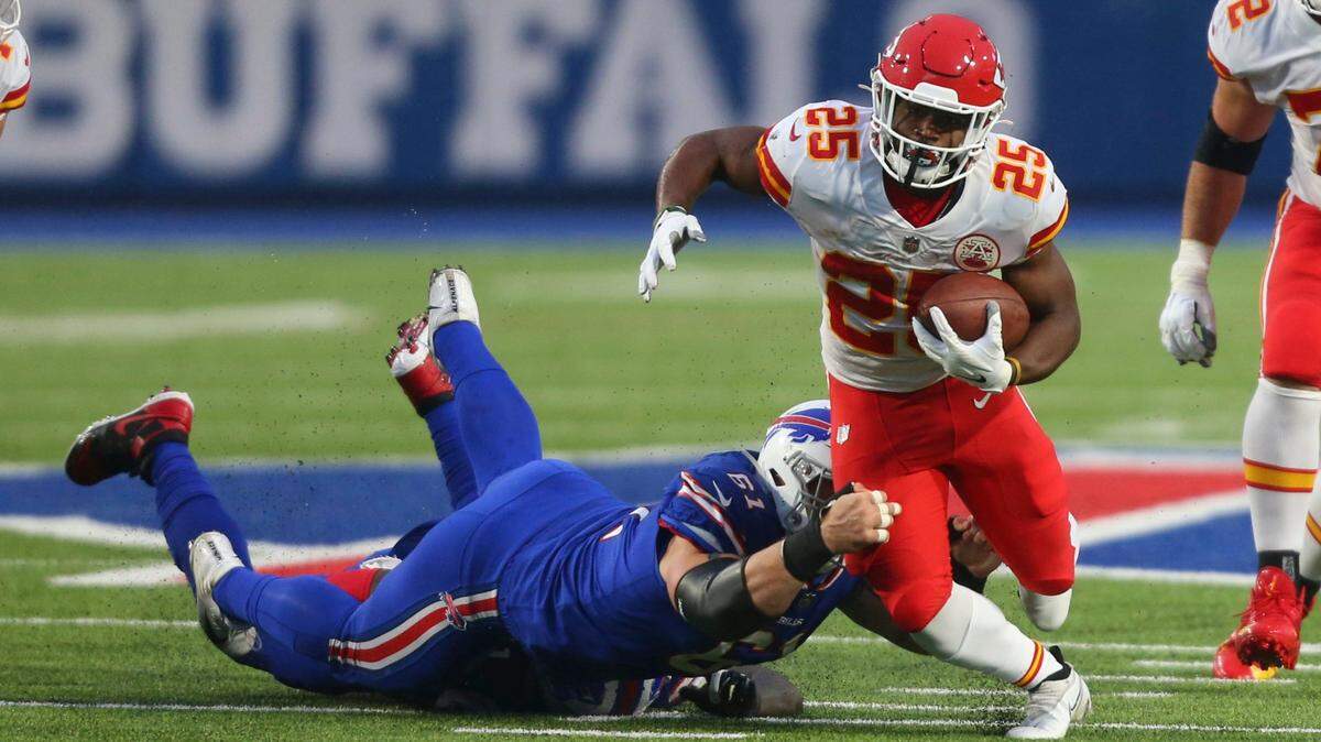 Clyde Edwards-Helaire, right, eclipsed 100 yards rushing early in the first half of Monday’s game against the Buffalo Bills in Orchard Park, N.Y.