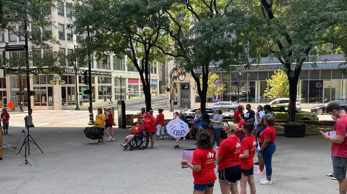 About three dozen VA workers from across Missouri gathers in downtown Kansas City outside the VA Heartland Network offices on Wednesday, Aug. 11, 2021.