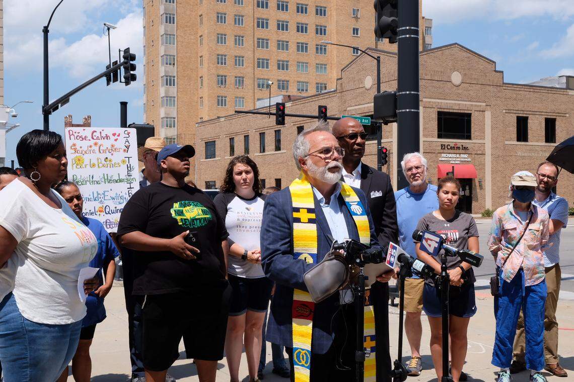 Members of MORE2, the Metro Organization for Racial and Economic Equity, gathered outside the Kansas City, Kansas, Police Department to announce the group will file a request for federal investigation of the department.