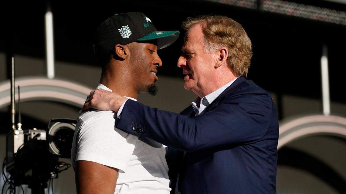 Former Wichita high school and Iowa State Cyclones star Breece Hall, left, was selected in Friday night’s second round of the NFL Draft by the New York Jets. After his selection, which he watched elsewhere on TV in Las Vegas, he went back to the draft site to get the congratulatory hug from NFL commissioner Roger Goodell.