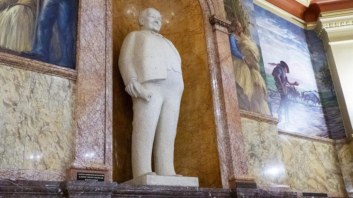 Legendary Emporia Gazette editor William Allen White stands watch in the Kansas Statehouse through this one-ton limestone statue.