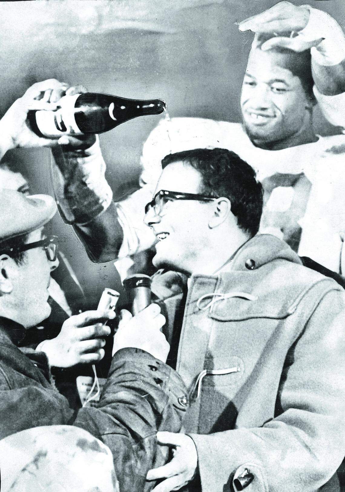 In this Jan. 1, 1967 file photo, Kansas City Chiefs linebacker Bobby Bell pours champagne over the head of team owner Lamar Hunt, after the Chiefs won the AFL championship game.