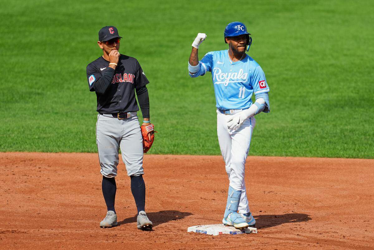 Kansas City Royals shortstop Maikel Garcia, right, celebrates after hitting an RBI double against the Cleveland Guardians during Monday afternoon’s game at Kauffman Stadium.