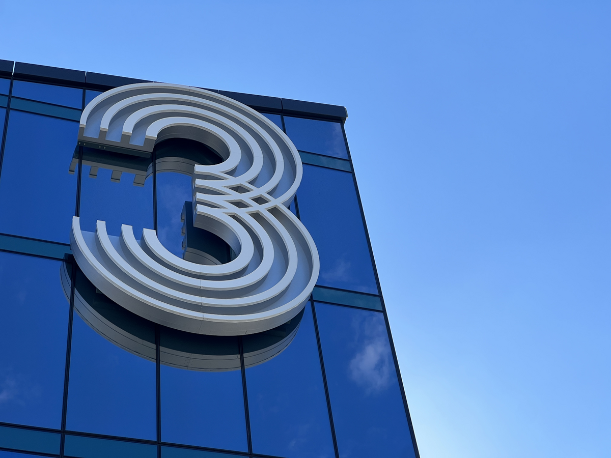 The number “3” atop the Three Light apartment building in downtown Kansas City is seen from a private balcony on the building’s 23rd floor.