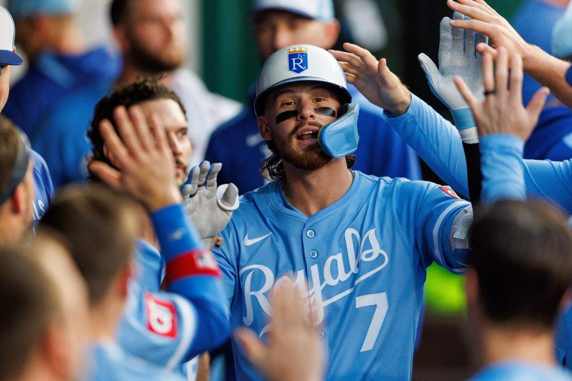 Royals shortstop Bobby Witt Jr. celebrates with teammates in the KC dugout after a belting a fourth-inning home run against the Toronto Blue Jays at Kauffman Stadium in Kansas City on Saturday, Sept. 20, 2025.