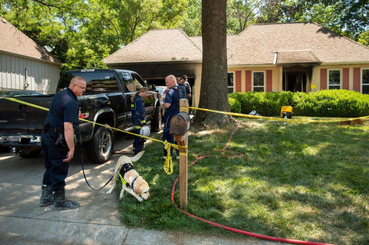 Fire investigators were searching for a cause after an early morning house fire left two people dead and a third person injured when a fire blazed through an Overland Park home early Monday in the 10300 block of Westgate Street in Overland Park. A trained canine was brought in to assist with the investigation.