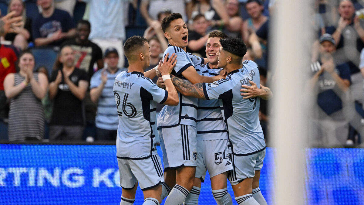 Sporting Kansas City midfielders Erik Thommy and Remi Walter and forwards Daniel Salloi and Alan Pulido celebrate after a goal against Minnesota United on Saturday at Children’s Mercy Park in Kansas City, Kan.