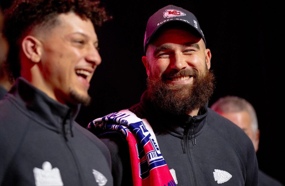 Kansas City Chiefs tight end Travis Kelce, right, laughs with quarterback Patrick Mahomes during Super Bowl LVIII’s Opening Night event at Allegiant Stadium on Monday, Feb. 5, 2024, in Las Vegas.