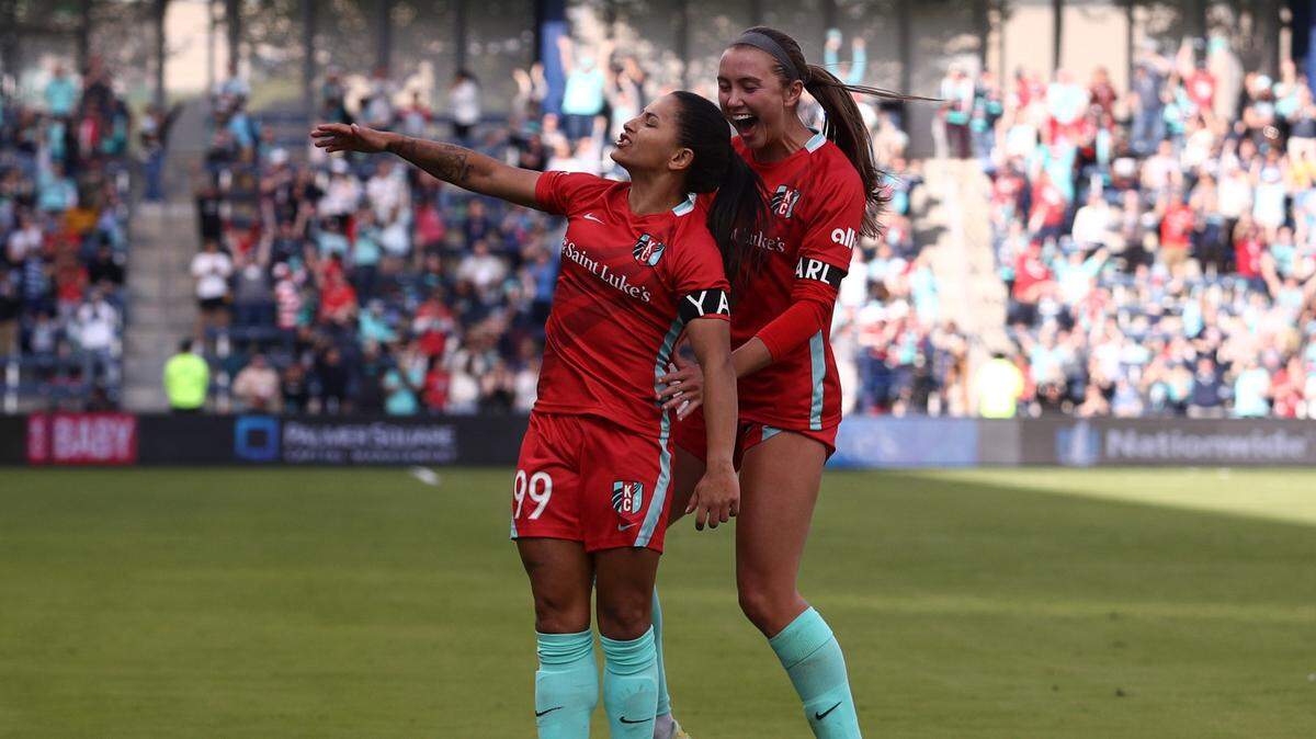 Kansas City Current midfielder Debinha, left, celebrates after scoring a goal during the second half against the Orlando Pride Sunday afternoon at Children’s Mercy Park.
