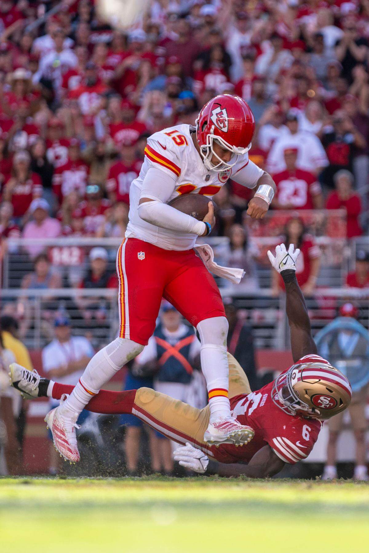 Kansas City Chiefs quarterback Patrick Mahomes (15) scores a touchdown against San Francisco 49ers safety Malik Mustapha (6) during the fourth quarter at Levi’s Stadium.