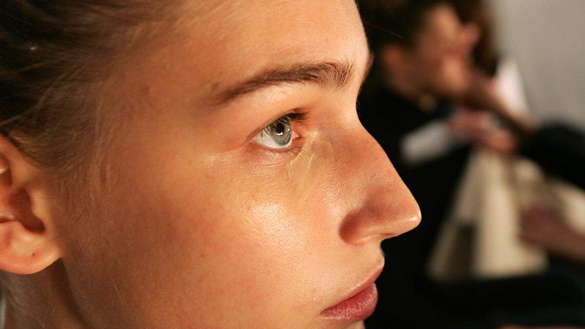 Under eye concealer being applied.