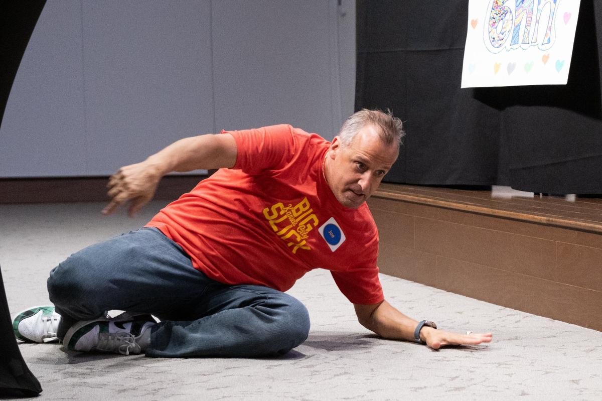 Joe Gatto slides on the floor in celebration of a correct answer during a round of Friendly Feud at the Big Slick Press Conference on Friday, May 31, 2024, at Children’s Mercy Research Institute.