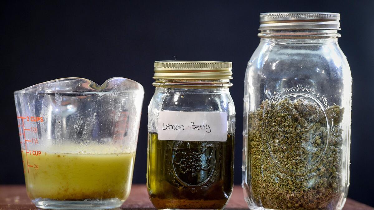 Patrice Harris of suburban Kansas City, who has both her medical marijuana and cultivator ID cards, uses marijuana buds, like the ones in the jar on the right, to make cannabis butter and tinctures. She cooks with the cannabis butter, using it in foods such as brownies and Rice Krispies treats.