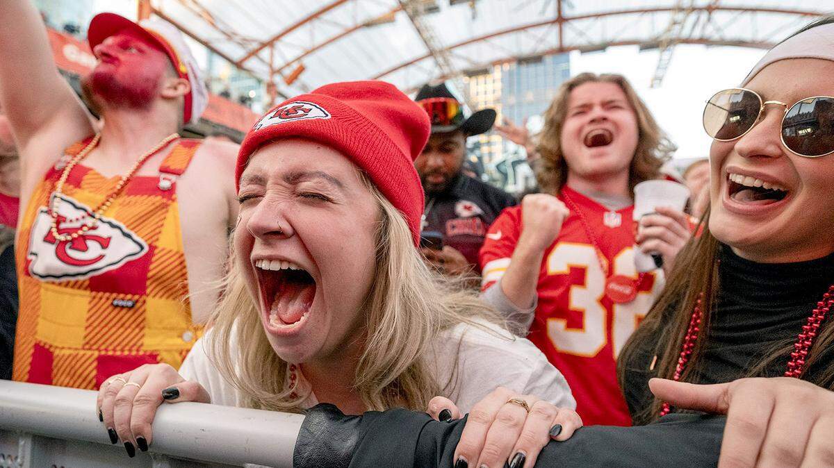 Chiefs fans including Kayla Spitzer of Independence, second from left, yelled as celebrated at KC Live! in the Kansas City Power & Light District as the  Chiefs defeated the Ravens, 17-10, for the AFC Championship on Sunday, Jan. 26, 2024, in Kansas City. 