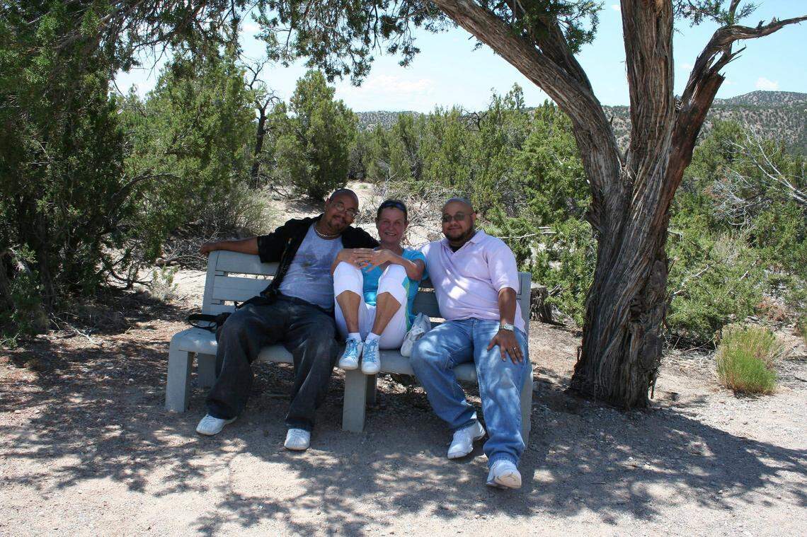 Julie Francois sits between her sons, Marvin and Richard Francois, in an undated family photo. Marvin Francois died at the age of 50 in a robbery Sunday near protests at the Country Club Plaza.