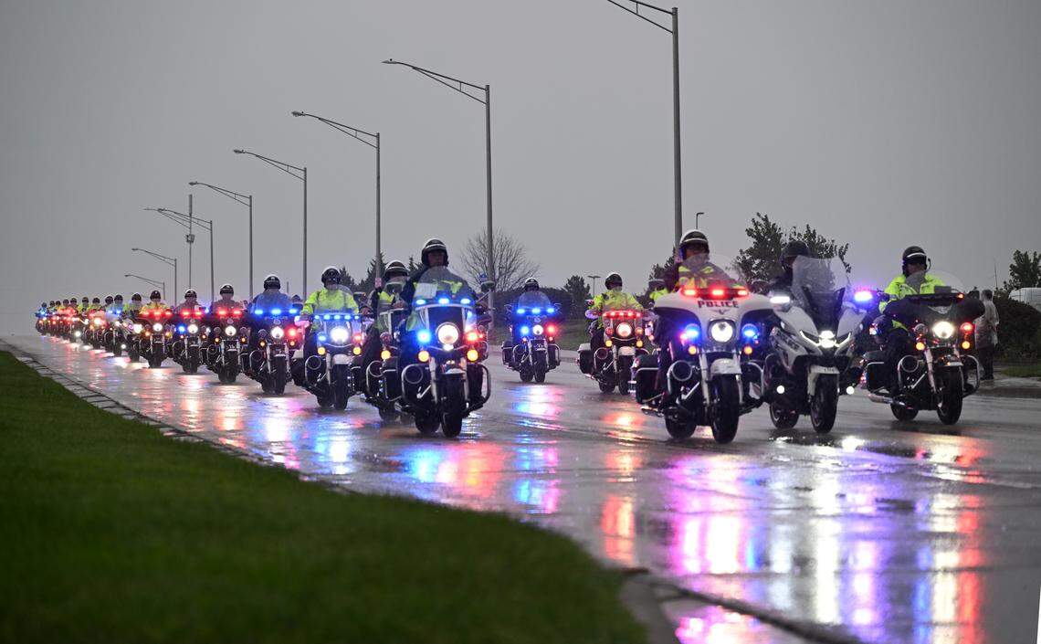 Dozens of law enforcement officers on motorcycles joined a procession to escort the hearse carrying the remains of Wyandotte County Sheriff's deputy Elijah Ming to his funeral service Monday, August 11, 2025, at Children's Mercy Park in Kansas City, Kansas.