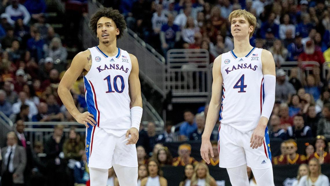 Kansas forward Jalen Wilson, left, and Gradey Dick watch a teammate shoot a free throw against Iowa State during this year’s Big 12 tournament in Kansas City.