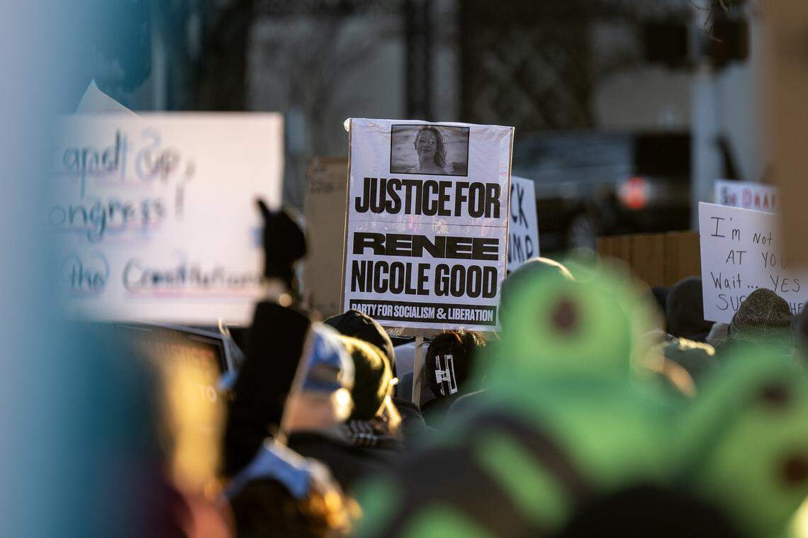 Demonstrators walk along Emanuel Cleaver II Boulevard during a vigil for victims of U.S. Immigration and Customs Enforcement on Saturday, Jan. 10, 2026, in Kansas City.