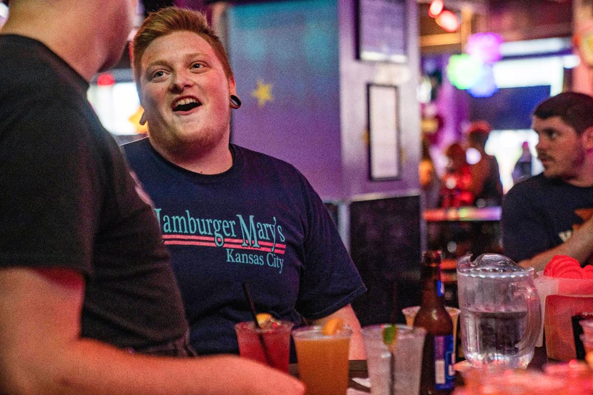 Silas Gardner talks with a co-worker,Thursday, June 24, 2021 at Hamburger Mary’s in Kansas City. Gardner, who is a lead server at the restaurant, says “Without Mary’s I would have never came out. Without this opportunity I would have never came out. There was no way”
