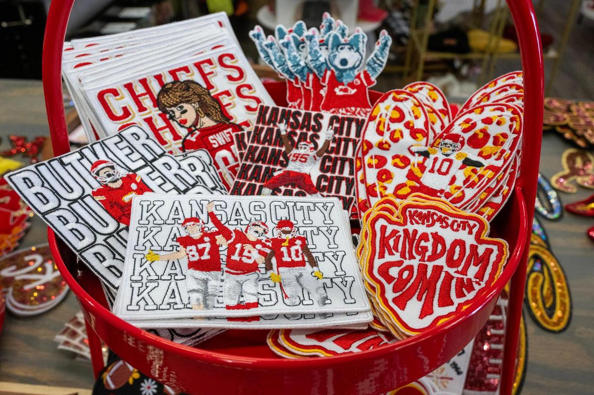 A basket of locally designed Chiefs-themed patches is displayed on the “patch bar” at Maxi Laine’s Boutique.