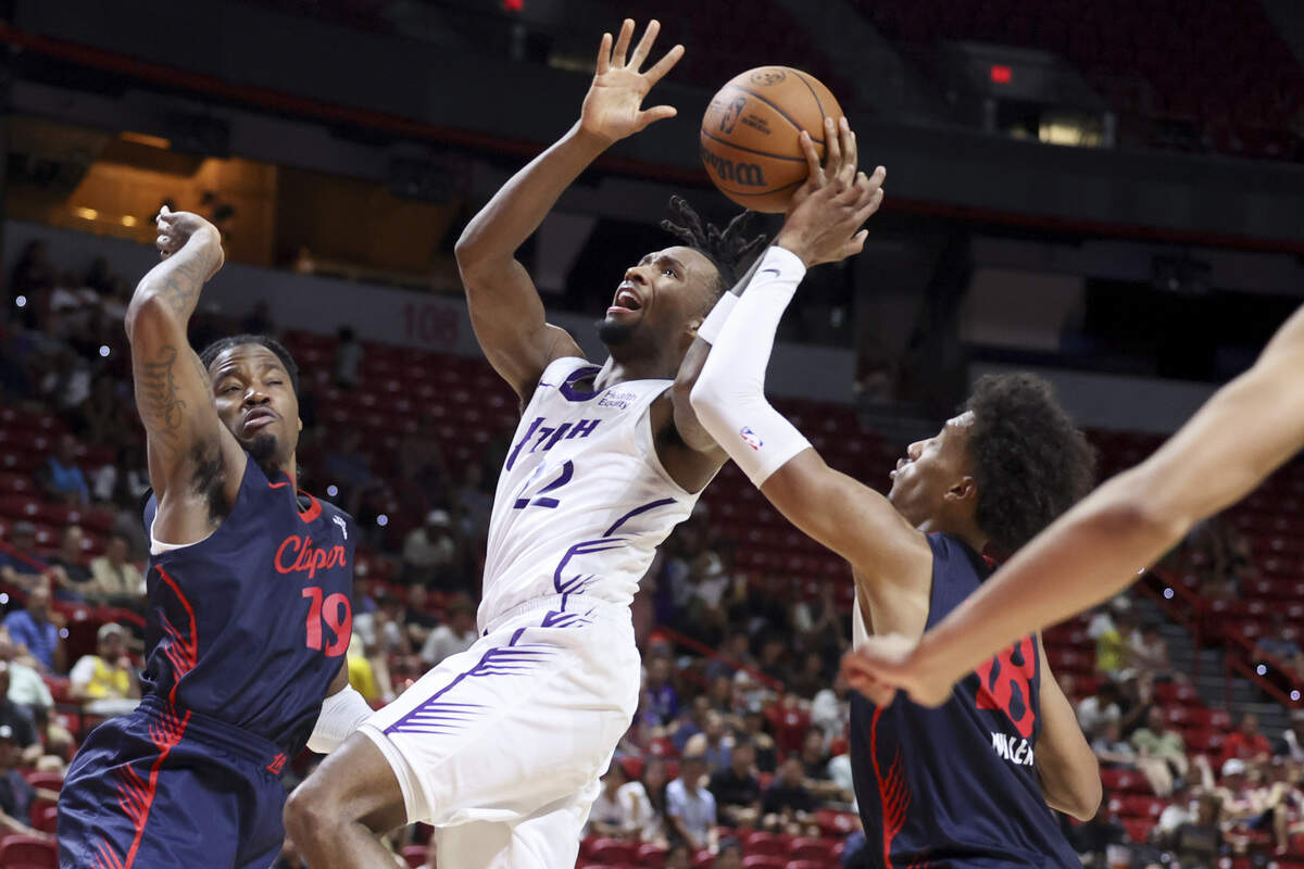 Darryn Peterson #22 of the Utah Jazz shoots against Jahmyl Telfort #19 and Baba Miller #18 of the LA Clippers in the fourth quarter of a 2026 NBA Summer League game at the Thomas & Mack Center on July 12, 2026 in Las Vegas.