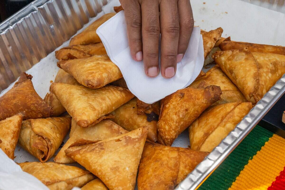 Sambosas, a spicy, fried Ethiopian dish with lentils and onions, at the Ethiopia vendor booth at the Ethnic Enrichment Festival in Swope Park on Saturday, Aug. 16, 2025, in Kansas City. The annual festival celebrates the many different cultures and ethnicities that exist in Kansas City, with vendor booths, cultural education opportunities, and performances. Temperatures reached nearly 100 degrees.