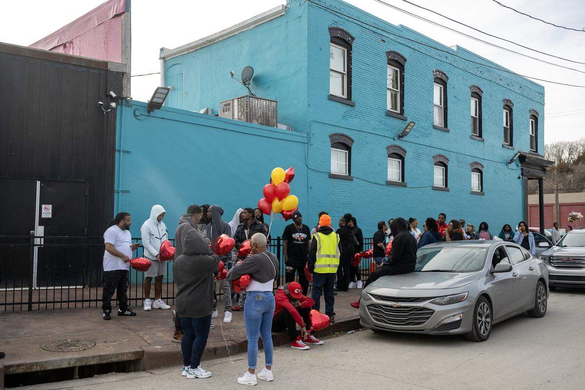 One day after a nightclub shooting left two women dead, family and friends gathered outside the club at 2801 Southwest Blvd. on Monday, Feb. 16, 2026, in Kansas City, to release memorial balloons for Eboni Silas and comfort one another. Authorities identified the victims as Eboni Silas, 29, and Tishauna Ballard, 23.