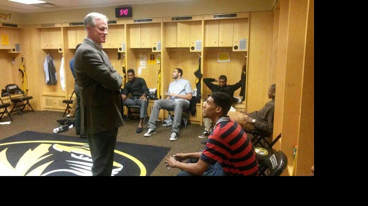 Missouri coach Kim Anderson talked to forward Cam Biedscheid in the men's locker room earlier this year. 