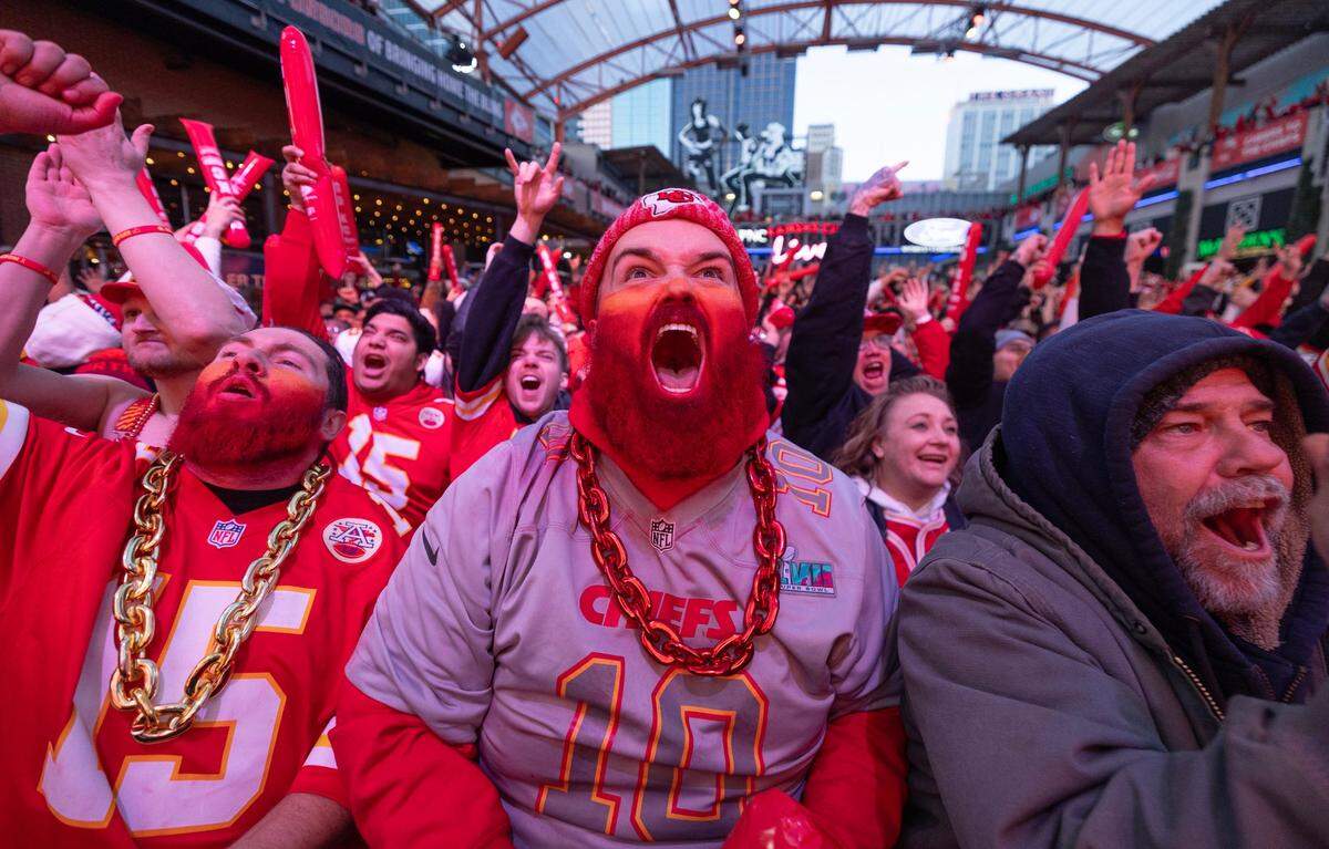 Taylor Garrison of Branson cheers after a San Fransisco fumble during the first quarter of the Super Bowl during a watch party in the Power and Light District in downtown Kansas City to watch Super Bowl 58 on Sunday.