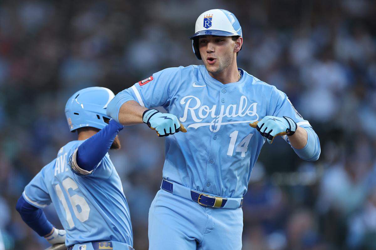 Jac Caglianone #14 of the Kansas City Royals celebrates with John Rave #16 after hitting a solo home run off Ben Brown #32 of the Chicago Cubs during the second inning at Wrigley Field on July 21, 2025 in Chicago, Illinois.