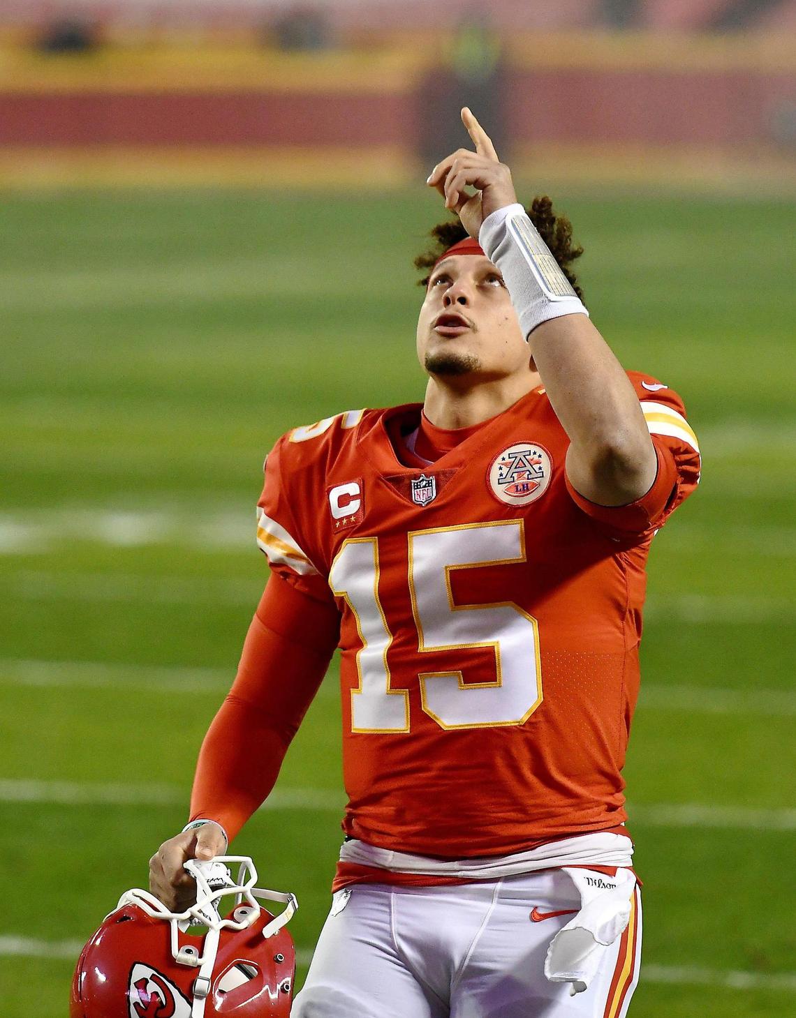Kansas City Chiefs quarterback Patrick Mahomes points to the sky Sunday, January 24, 2021, before the AFC Championship Game at Arrowhead Stadium in Kansas City, Missouri.