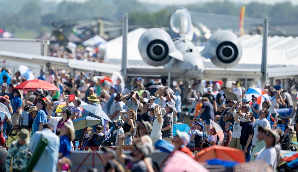 People watch as the U.S. Navy Blue Angels fly during the Garmin KC Air Show on Saturday, Aug. 19, 2023, in New Century.