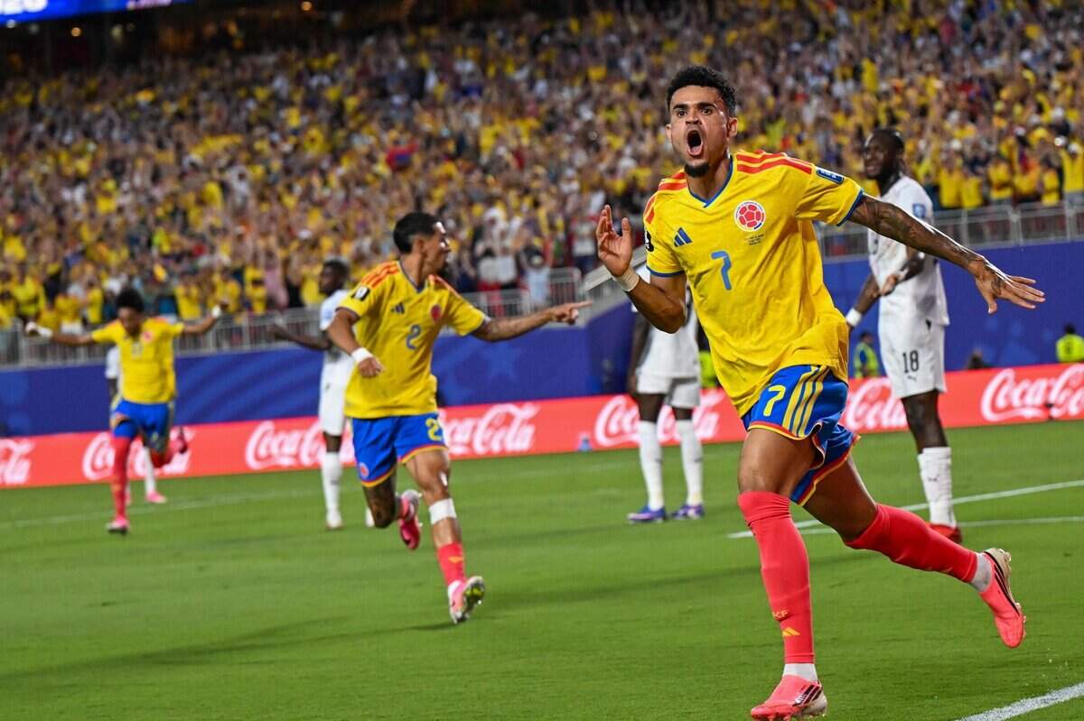 Colombia forward Luis Díaz (7) celebrates after making the assist to Colombia midfielder Jhon Arias (11) to score the first goal of the match against Ghana in the 2026 World Cup round of 32 football match at Kansas City (Arrowhead) Stadium in Kansas City on Friday, July 3, 2026.