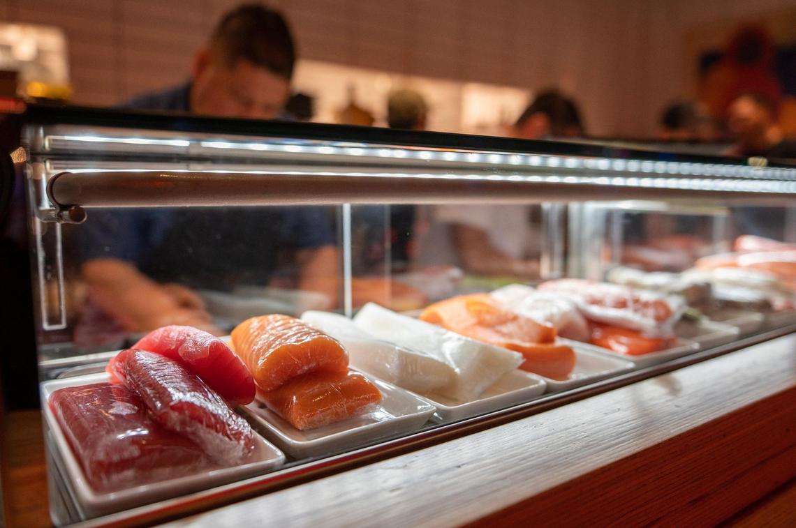 A variety of fish is on display in a glass case at the Blue Sushi Sake Grill in the Power & Light District.