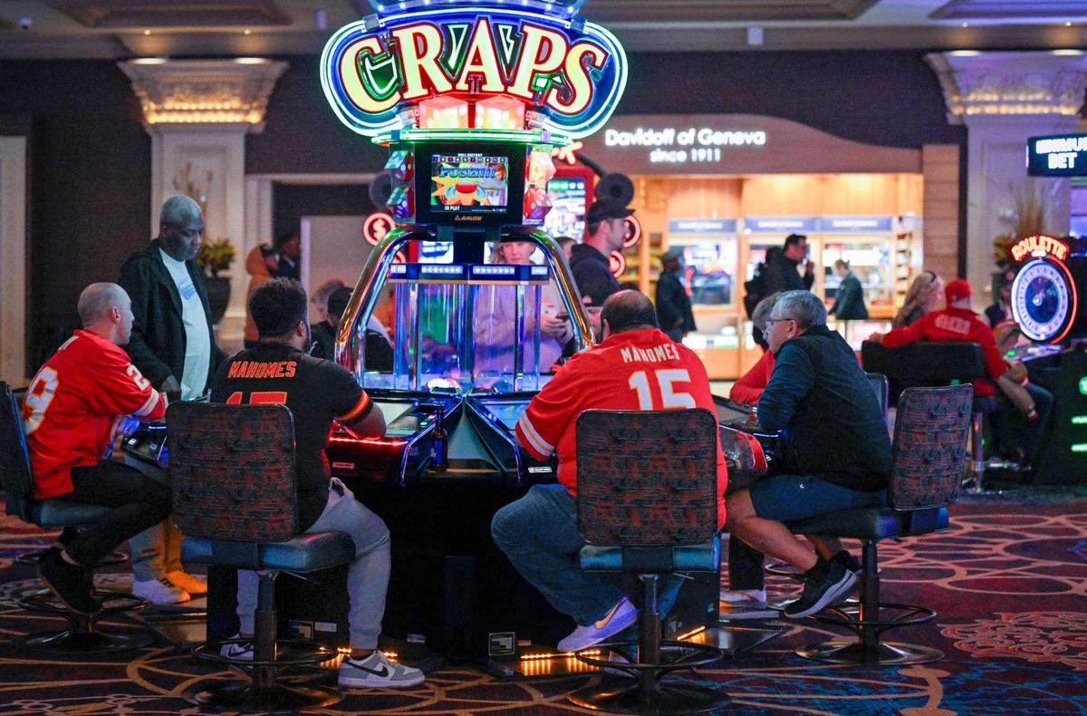 Kansas City Chiefs football fans hit the Craps table in a casino on the strip on Saturday, Feb. 10, 2024, in Las Vegas.