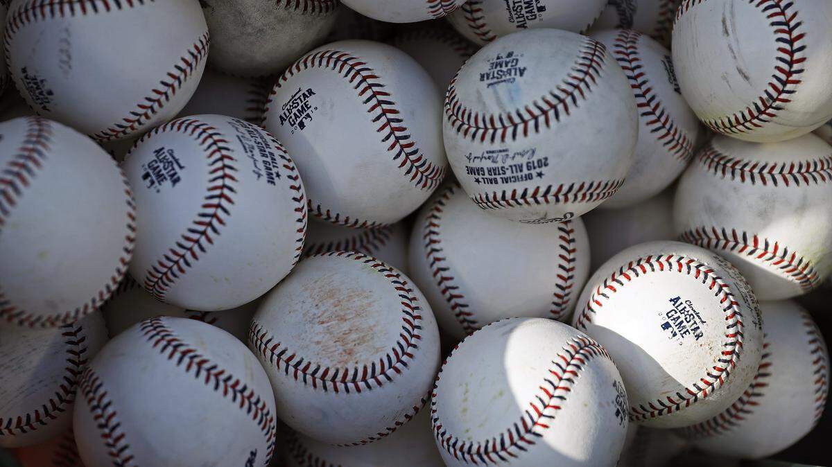 Baseballs are pictured as the American League players take batting practice before the MLB baseball All-Star Game, Tuesday, July 9, 2019, in Cleveland. Faced with a record onslaught of home runs and pitchers convinced baseballs are juiced, Commissioner Rob Manfred says the sport has been unable to find any changes in the manufacturing process. (AP Photo/John Minchillo)