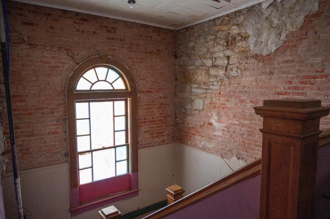 Exposed brick walls adorn the stairwell at the Justice and Dignity Center building on Wednesday, March 20, 2024, in Kansas City.